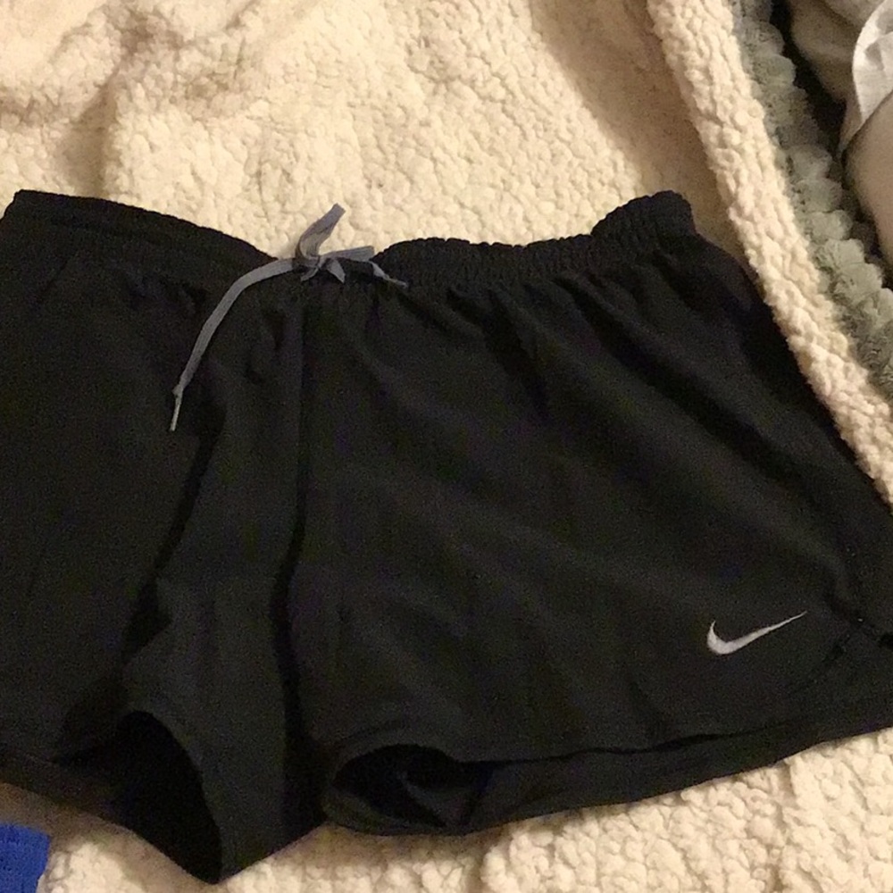 Two pair of Nike training shorts. Very lightly worn. Medium
